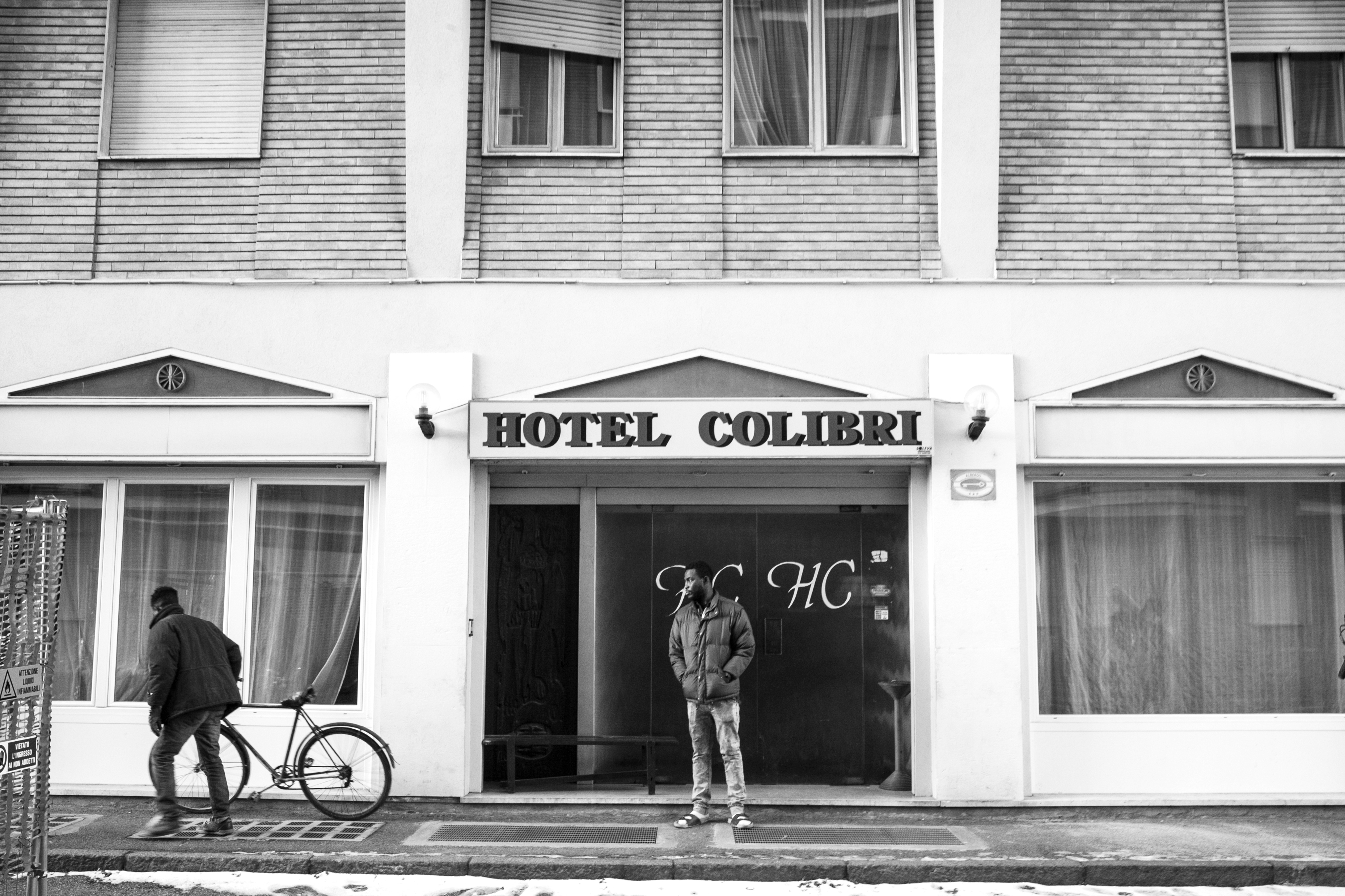 Entrance of Hotel Colibri, the closed hotel-turned-temporary reception centre in Biella where Malick lives. (Photo: César Dezfuli)
