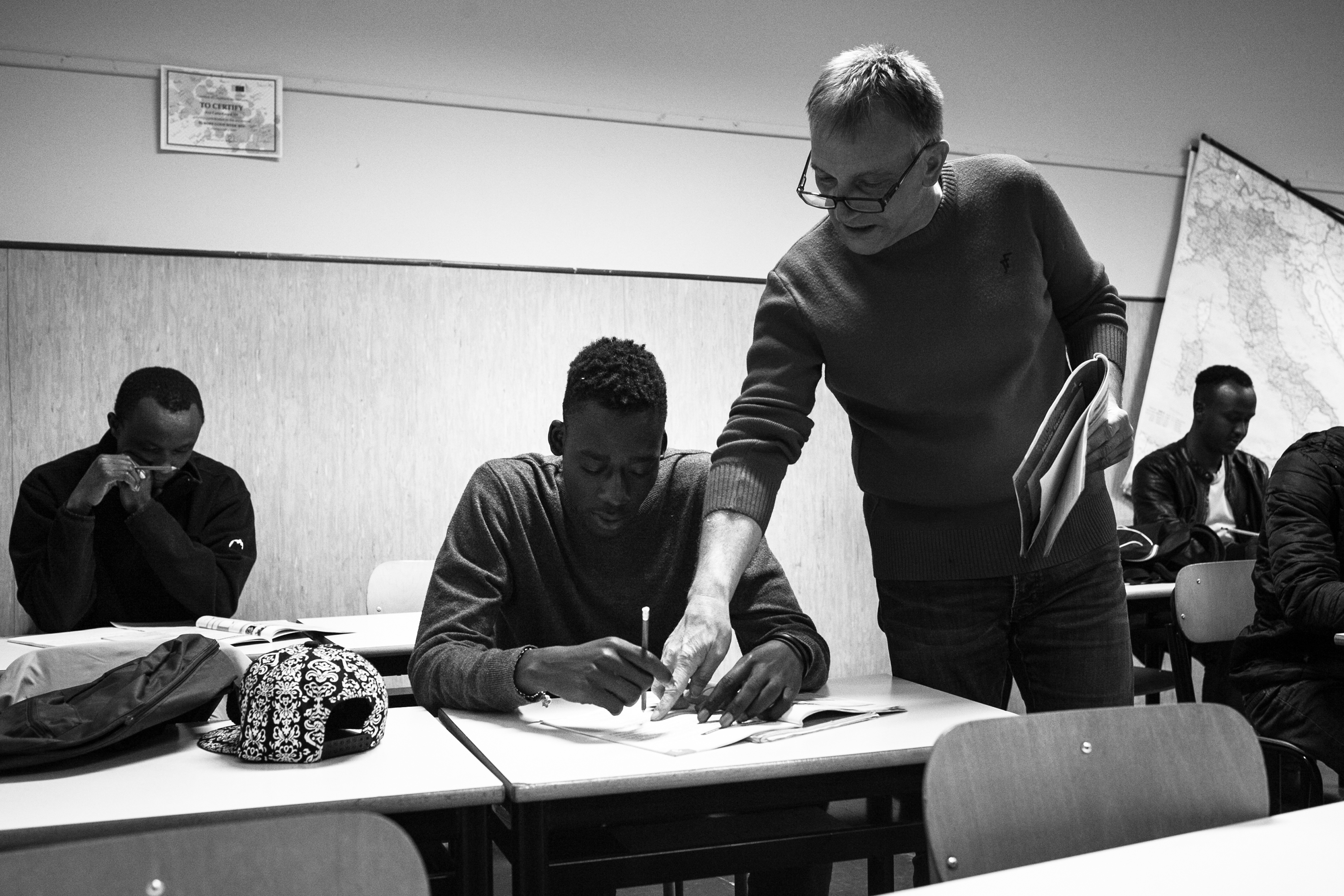 Malick, along with his colleagues from Hotel Colibri as well as from other migrant centers in Biella, attending Italian classes. All migrants receive Italian classes twice a week, in which they learn basic conversational skills to get on in their daily lives, as well as how to prepare their CV. (Photo: César Dezfuli)
